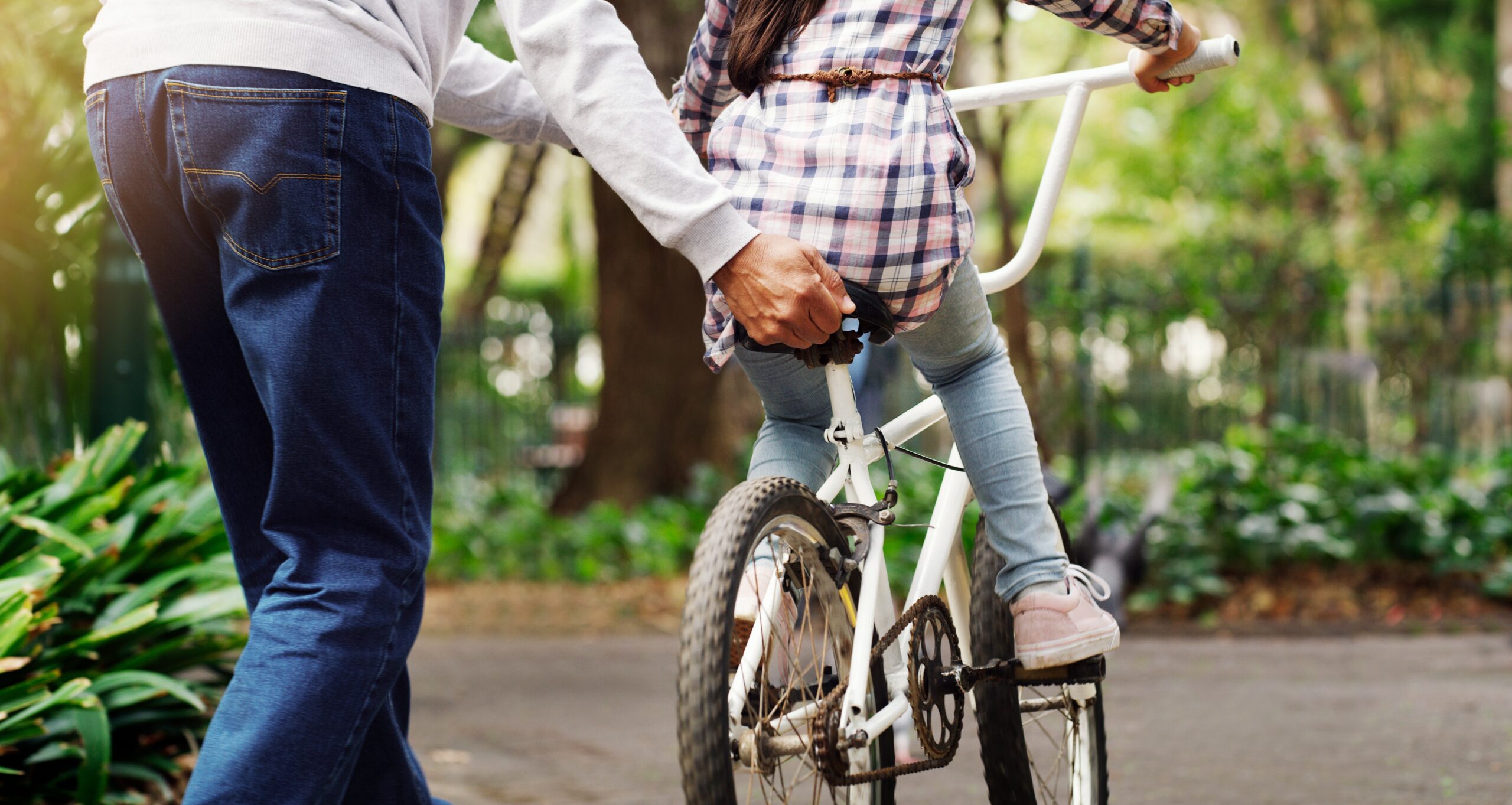 Father,Teaching,His,Child,To,Ride,A,Bicycle,On,A